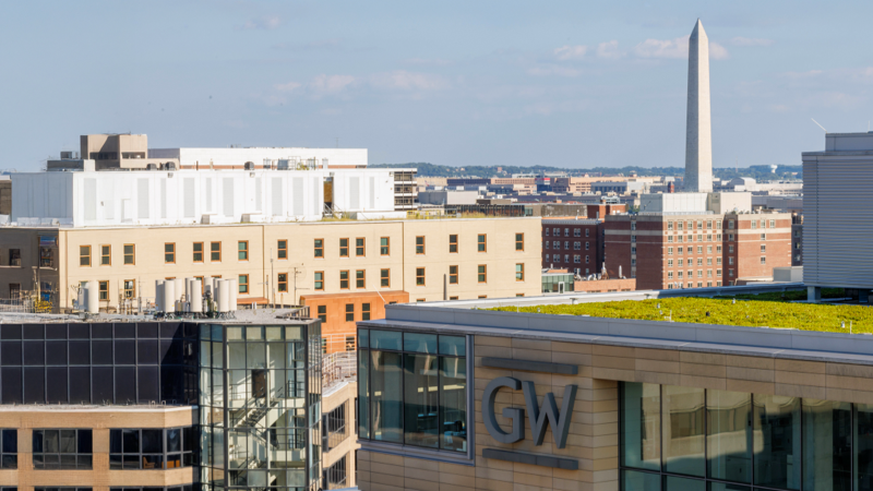 GW campus with the Washington Monument in the background behind campus buildings